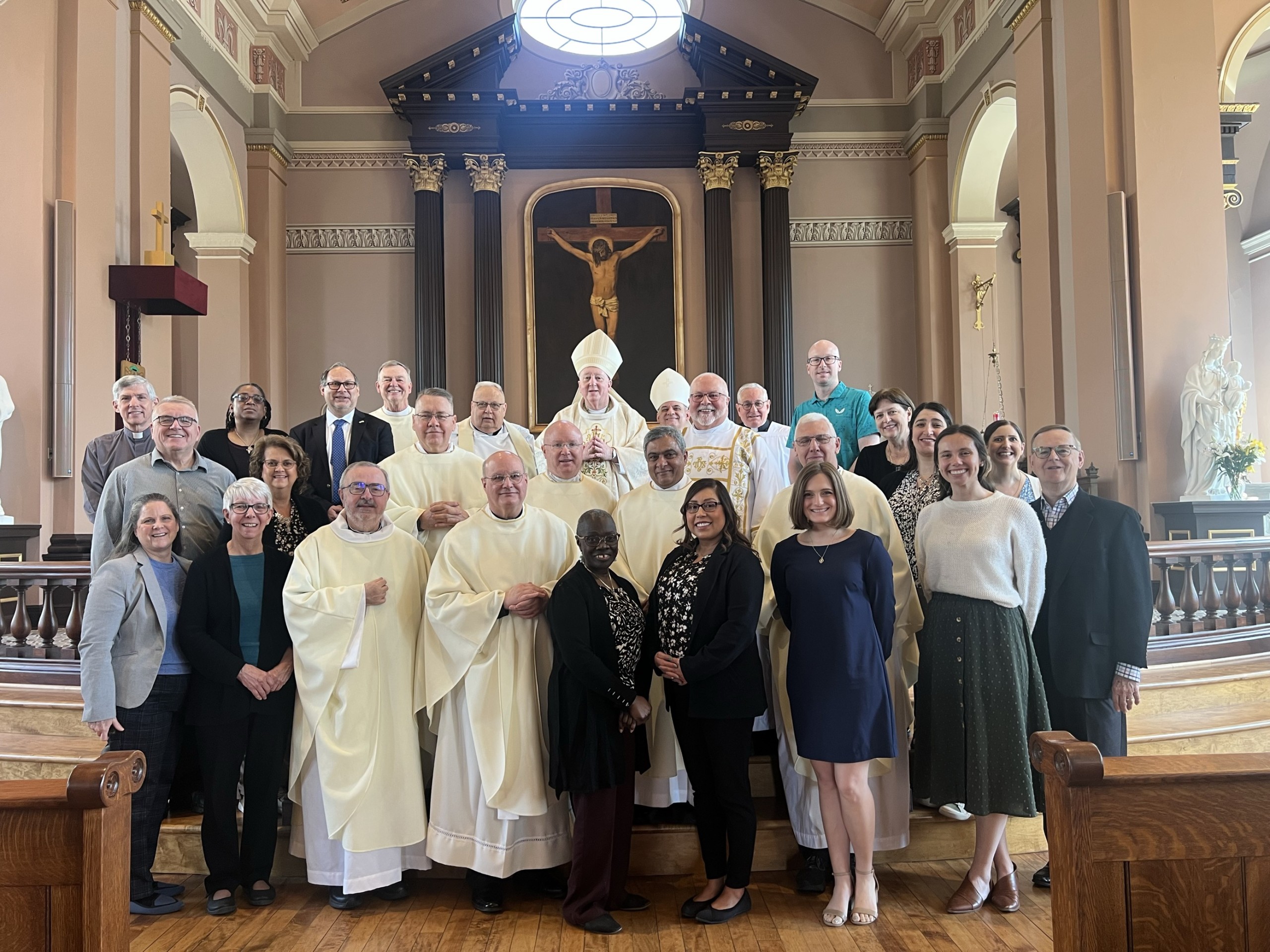 TPSM USA representatives from 18 dioceses together with Archbishop Mitchell Rozanzki and our National Director, Monsignor Roger J. Landry in the Basilica of St. Louis, King of France (Old Cathedral), in St. Louis, Missouri, during a TPMS Midwest Regional Meeting on March 25, 2025, Solemnity of the Annunciation of the Lord.