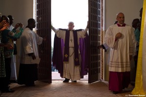 Pope Francis walks through the Holy Door after opening it to begin the Holy Year of Mercy at the start of a Mass with priests, religious, catechists and youths at the cathedral in Bangui, Central African Republic, Nov. 29, 2015. (CNS photo/L'Osservatore Romano)