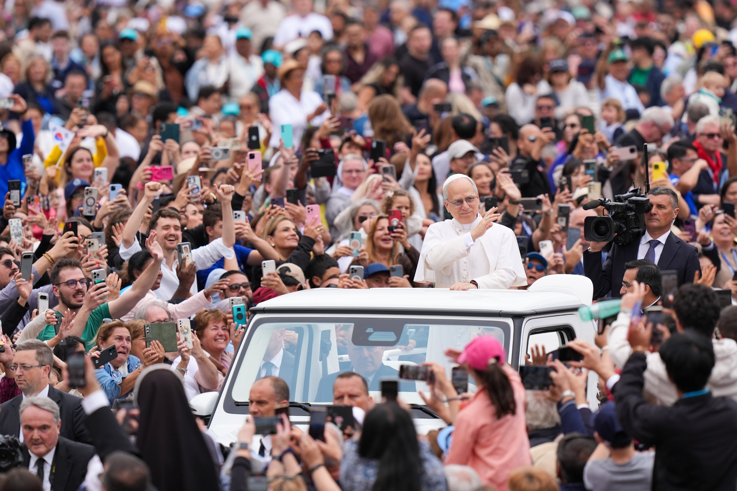POPE LEO XIV GENERAL AUDIENCE MAY 21, 2025 Pope Leo XIV rides through St. Peter's Square at the Vatican May 21, 2025, before holding his first weekly general audience. (CNS photo/Lola Gomez)