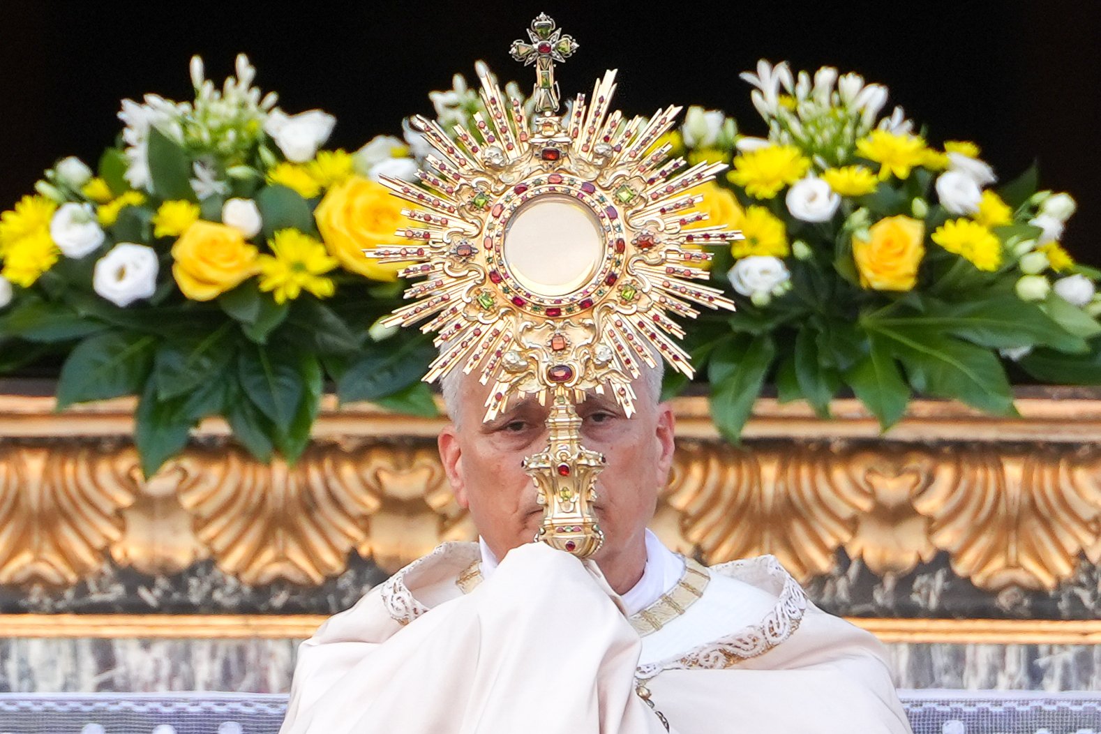 Pope Leo XVI raises the monstrance during Benediction after a Corpus Christi.