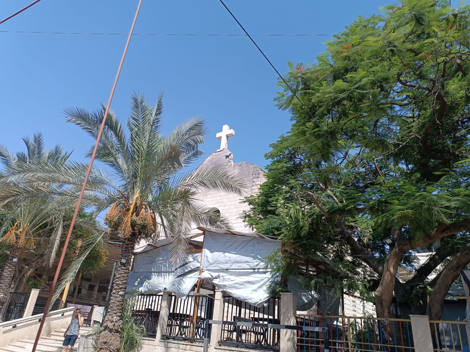 HOLY FAMILY CHURCH GAZA DAMAGED Damage can be seen next to the cross on the roof of the Holy Family Church in Gaza after it was hit in an attack July 17, 2025. At least two people died and another 11 were injured, including the parish priest, Father Gabriele Romanelli, who sustained a slight injury to his right leg. (CNS photo/courtesy Aid to the Church in Need, UK)